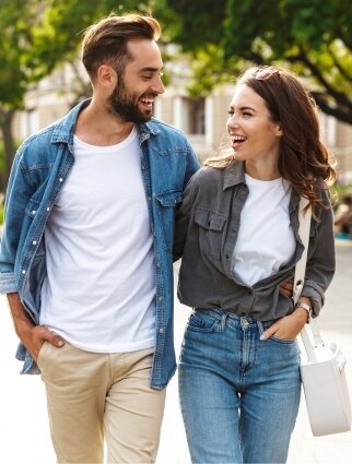 Man and woman sitting together outdoors